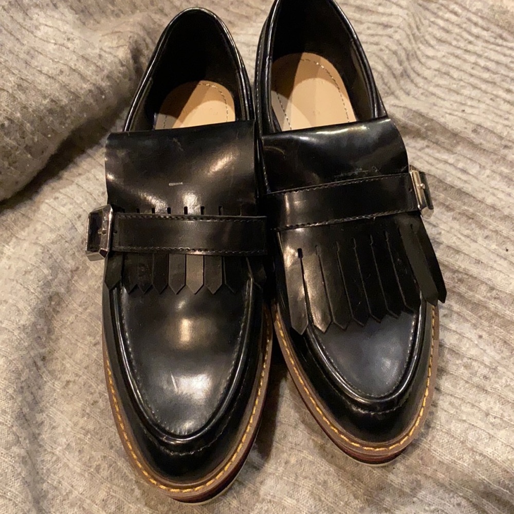 Black patent Oxford platforms.